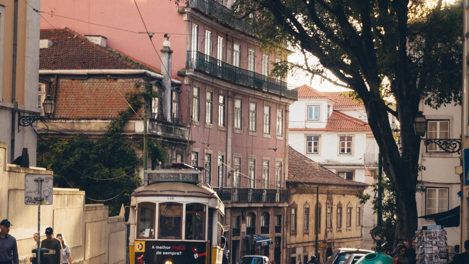 A tram on a historic street in Lisbon.